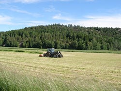 Farming with a tractor in Sweden.