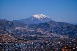 View of La Paz from El Alto with the Illimani mountain in the background.