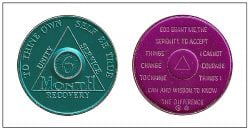 AA medals, given to those who have been sober a certain number of months, on the back is the Serenity Prayer
