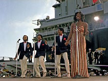 Gladys Knight & the Pips perform aboard the aircraft carrier USS Ranger on November 1, 1981. Left to right: William Guest, Edward Patten, Merald "Bubba" Knight, and Gladys Knight.