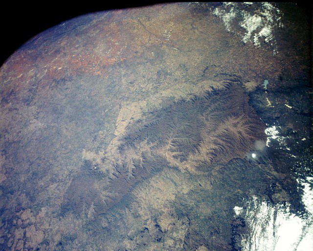 Drakensberg range from space showing brown basalt and pale sandstone layers.