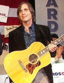 Jackson Browne on stage at a political rally