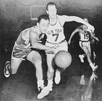Bob Cousy (left) going after the basketball