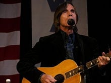 Jackson Browne on stage at a political rally