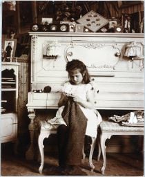 Grand Duchess Anastasia knitting in her mother's boudoir.