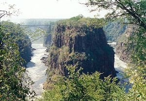 Victoria Falls gorge and bridge. The peninsular cliffs are in Zambia, the outer cliffs in Zimbabwe.
