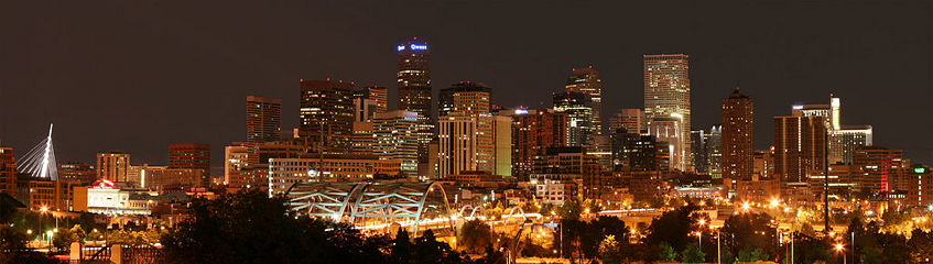 The skyline of downtown Denver with Speer Boulevard in the foreground, facing east.