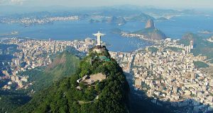 Christ the Redeemer on Corcovado with Sugarloaf Mountain and Guanabara Bay (background)