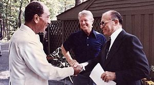 Manchem Begin, Jimmy Carter, and Anwar Sadat pose at their historic Camp David summit