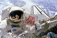 NASA astronaut with for sale sign on EVA - to retrieve sattlite.jpg