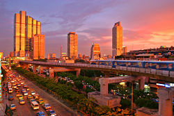 A BTS skytrain passing the Sathon area of Bangkok.
